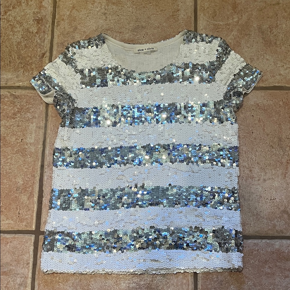 Alice and Olivia sequined top. Feels like Medium in size. No damage.